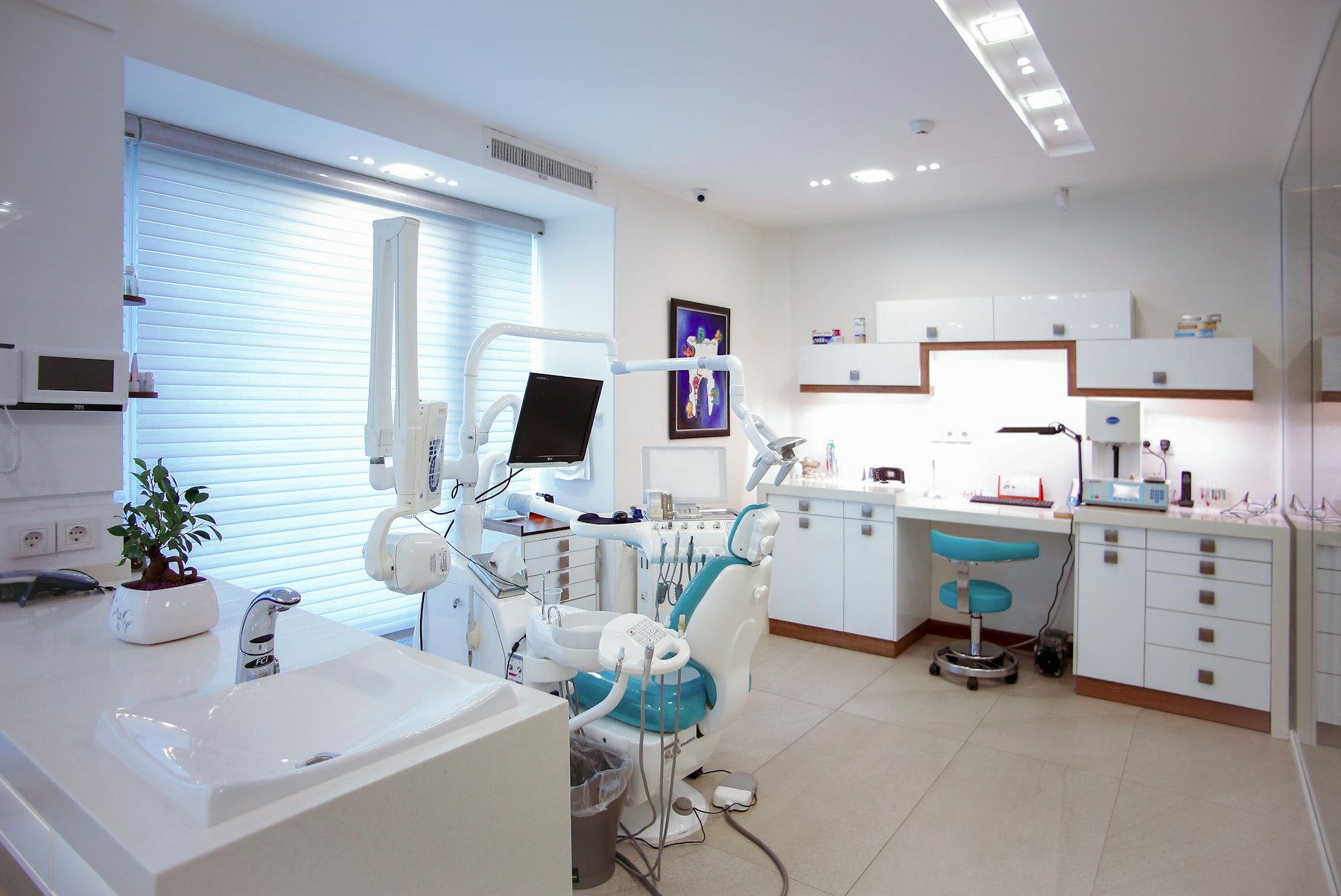 Bright, modern dental treatment room with a patient chair