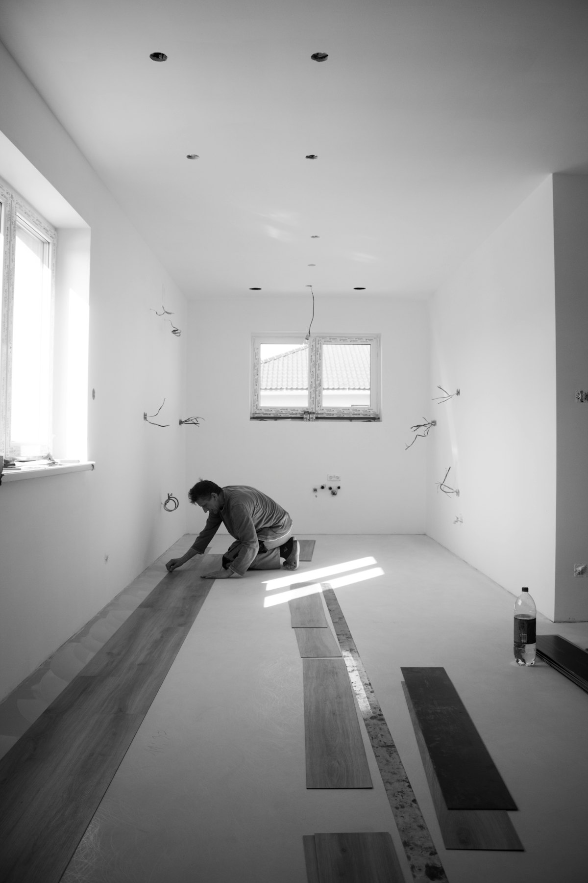 Installer laying floorboards