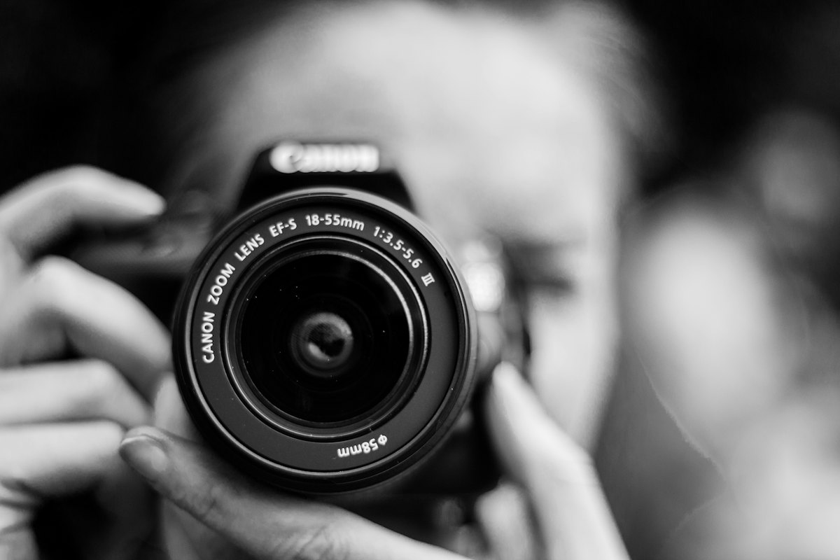 Photographer taking a photo with a camera