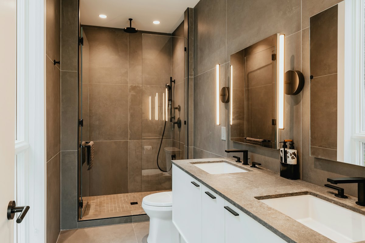 Renovated bathroom with a walk-in shower and double vanity